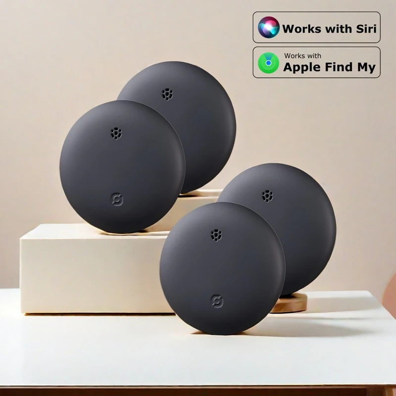 Close-up of black mini smart tracker product set